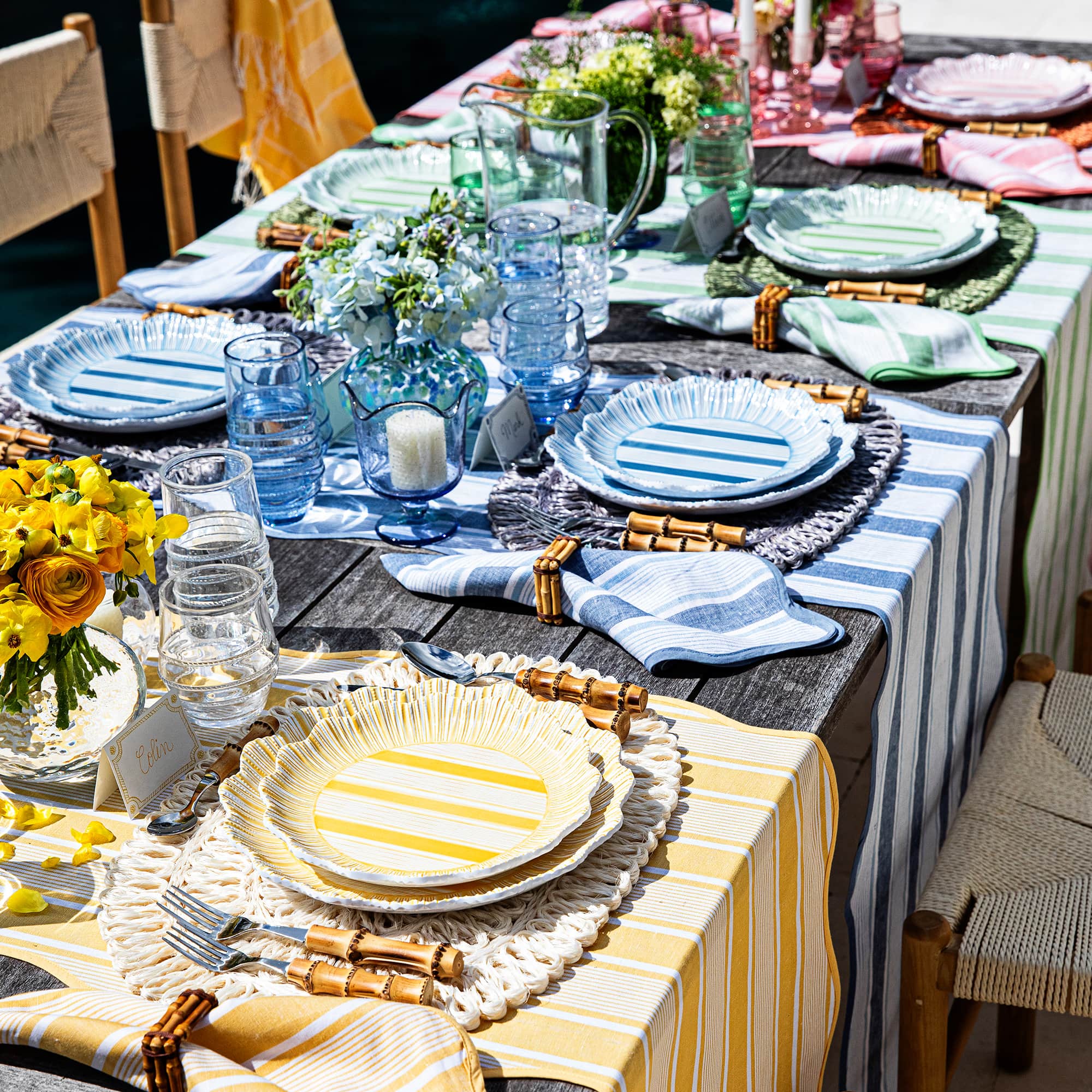 Colorful cabana melamine plates set up within a tablescape