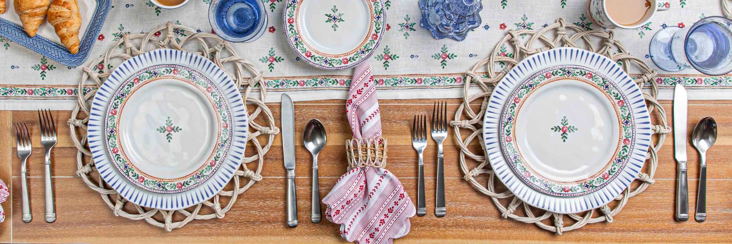 Two Heidi Salad plates within a place setting on a Heidi Runner