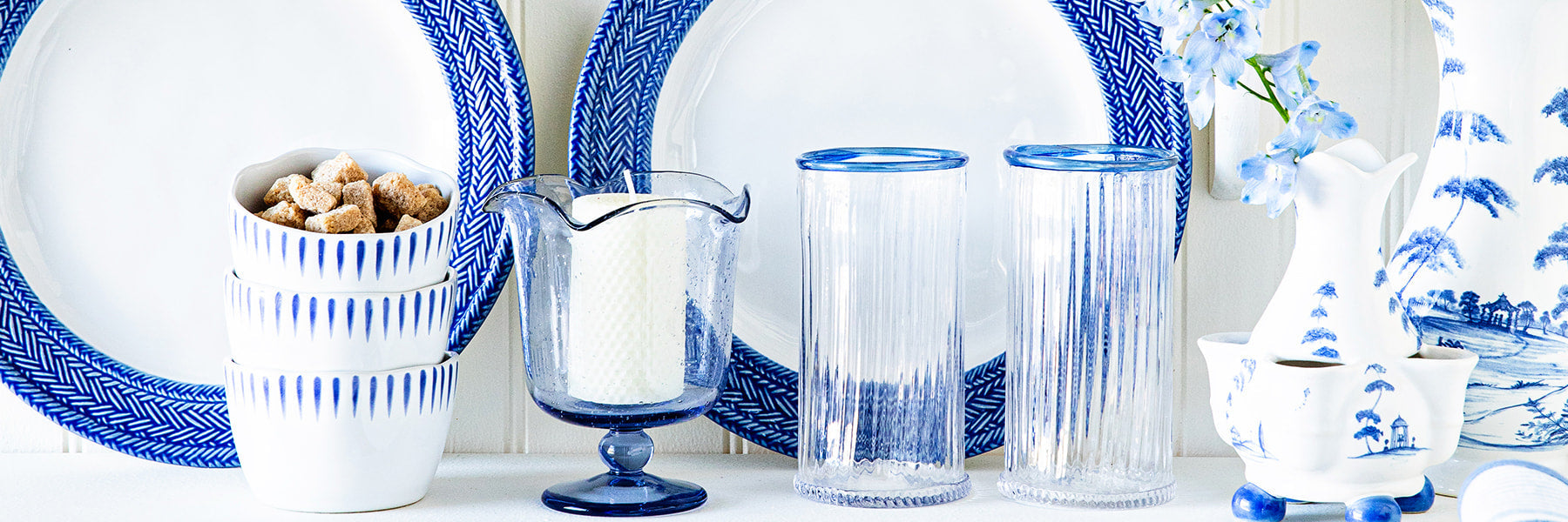 Image depicting Le Panier plates, sitio stripe ramekin, Nell glassware and Country Estate vases on a shelf