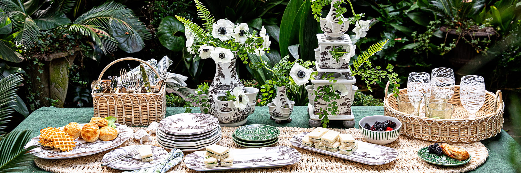 Picnic set-up featuring Country Estate flint, Provence Rattan trays and placemats, and Jardin Du Monde basil plates