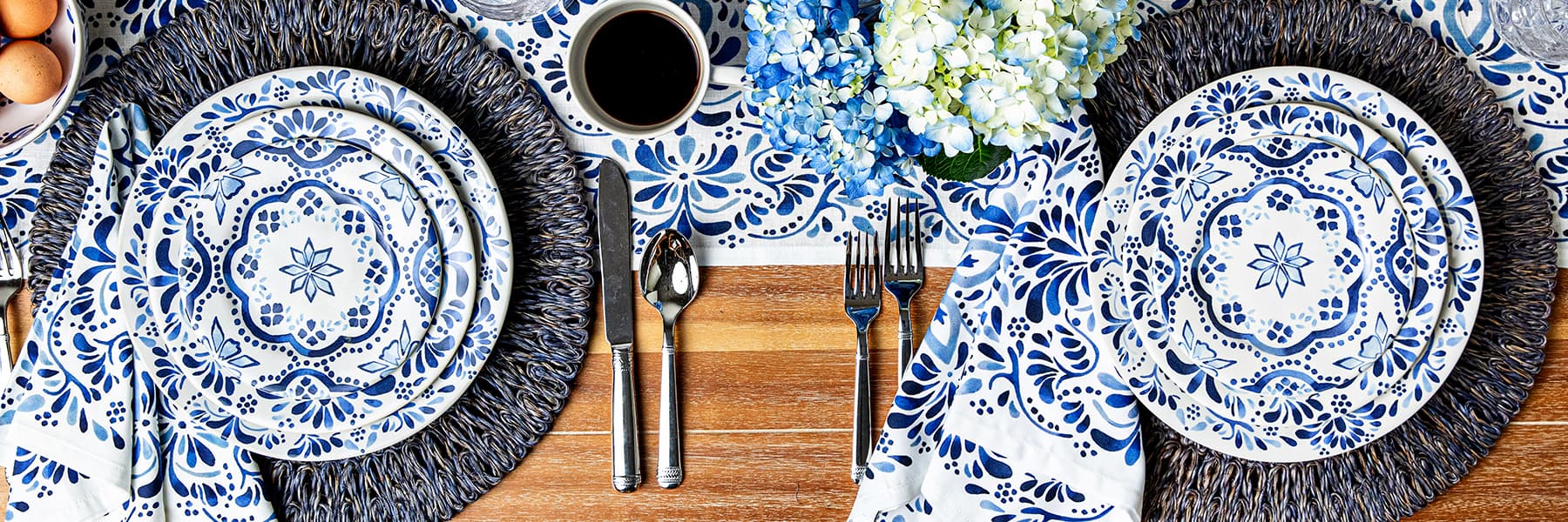 Iberian Indigo plates set within a tablescape on a wood table