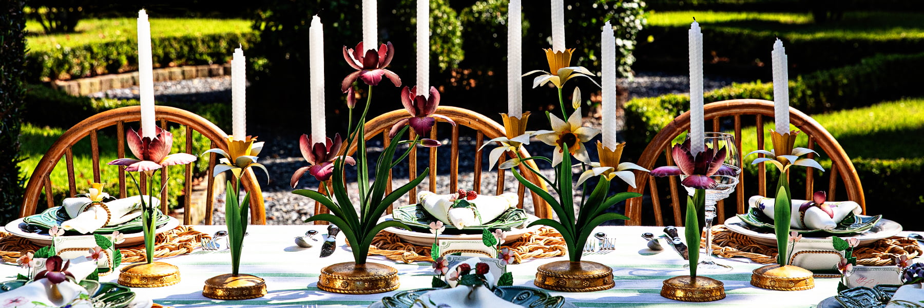 Image depicting pink and yellow Meadow Walk candelabras amongst an outdoor tablescape
