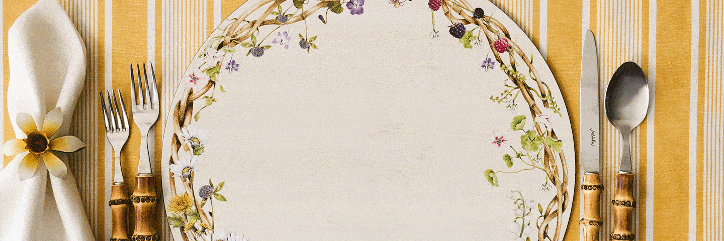 Moveable gif featuring meadow walk placemat, napkin ring, & napkin. On the placemat, the plates switch between Jardin Du Monde, Blenheim Oak, Bamboo, Le Panier and Bilbao plates