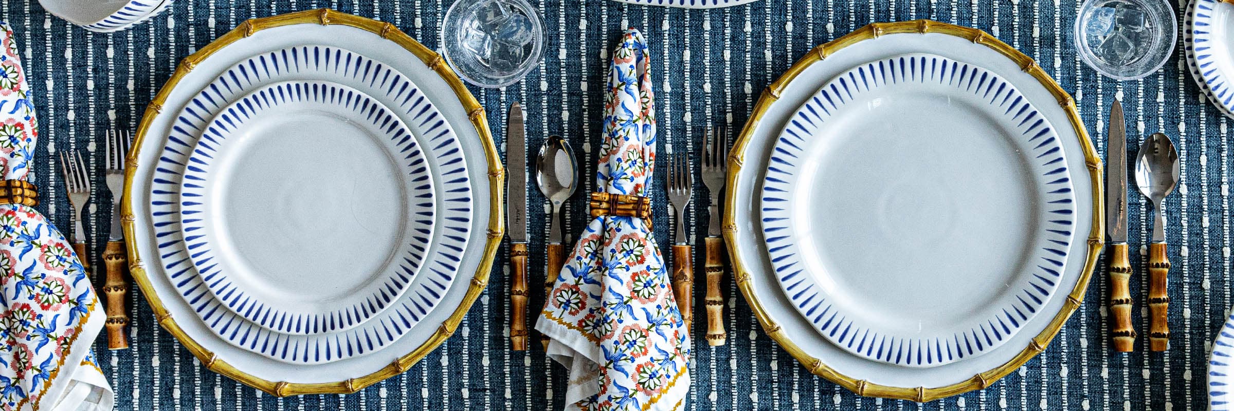 Sitio Stripe place setting featuring a sitio stripe dinner and dessert plate in delft blue