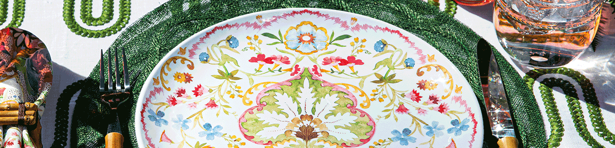Rotating melamine plates in colorful patterns creates a beautiful placesetting.