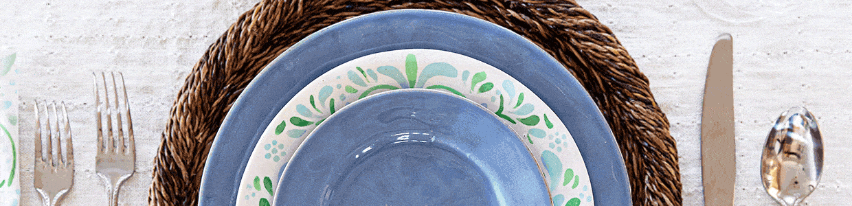 Mix and match place setting featuring an Iberian Sage Salad Plate mixed with blue, green, white and bamboo plates