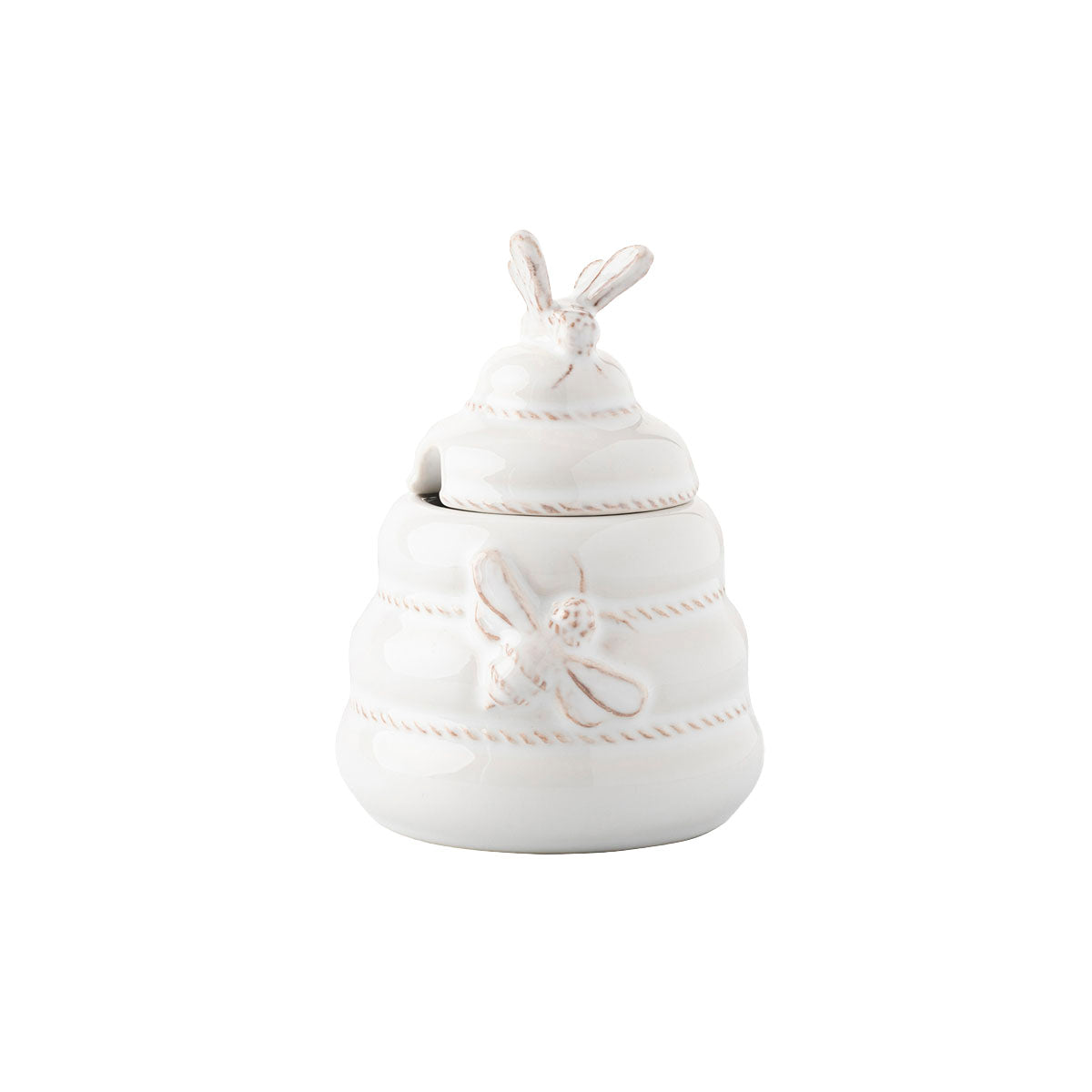 From breakfast to tea time, this beautifully sculpted ceramic hive gives a home to your favorite honey - with a lid and wooden spoon for serving.