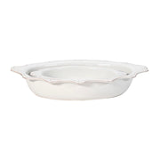 A space-efficient nesting set that’s as pretty as it is practical! Our abundantly sized 18” oval baking dish boasts a striking scalloped rim to frame whatever triumph you bake and serve up for large crowds on holidays, special occasions, and weekends. Pair it with our 11” oval baking dish, designed to complement and nestle neatly inside for fabulous, functional storage in your cupboard.