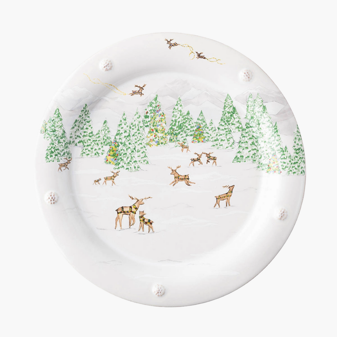 Decorative plate with a winter scene featuring deer and trees on a white background