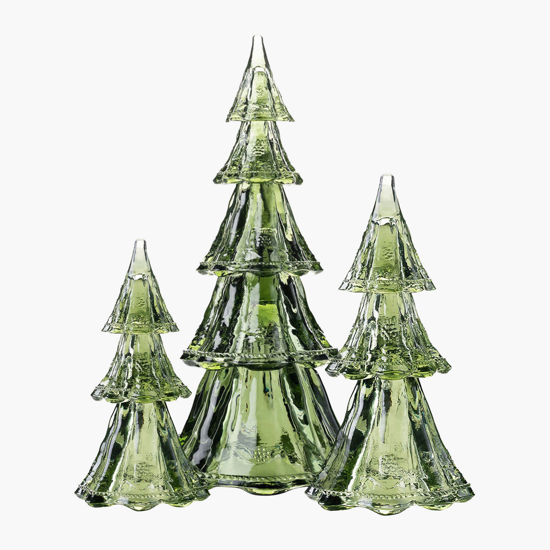 Set of three green glass Christmas trees on a white background