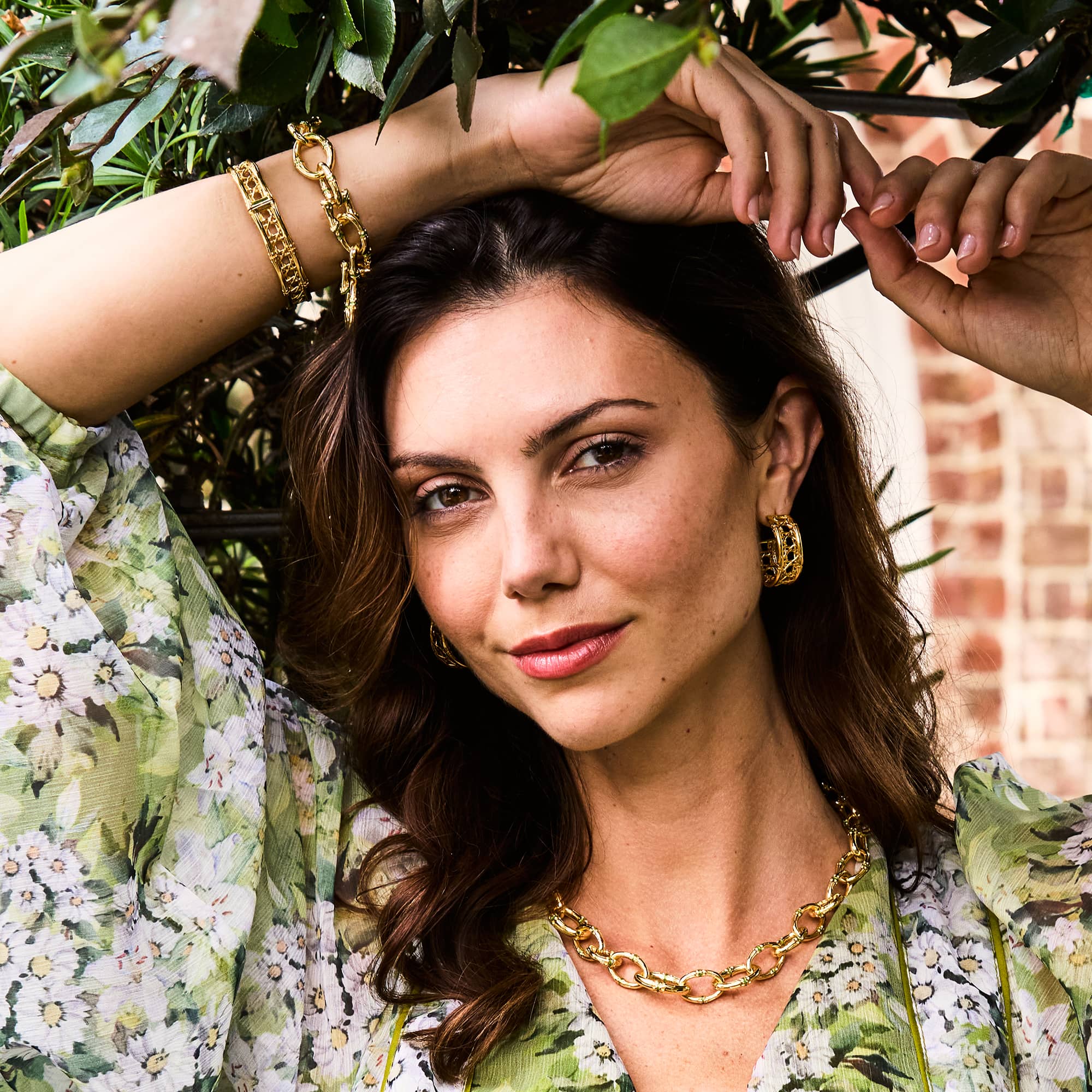 Woman posing under a tree wearing bangkok bamboo jewelry