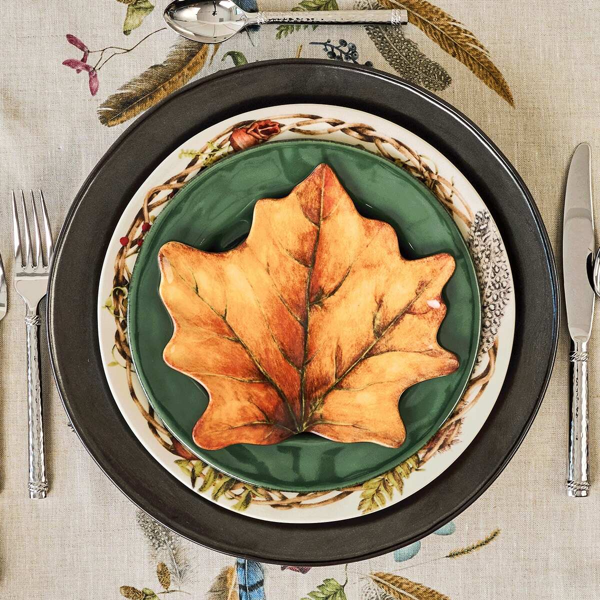 Forest Walk plates with mixed with green and black plates within a place setting