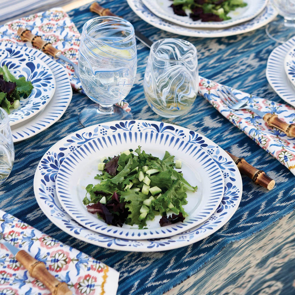 Sitio Stripe in Delft Blue on a blue tablecloth.
