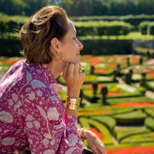 Capucine De Wulf Gooding, founder, gazes over French garden views.