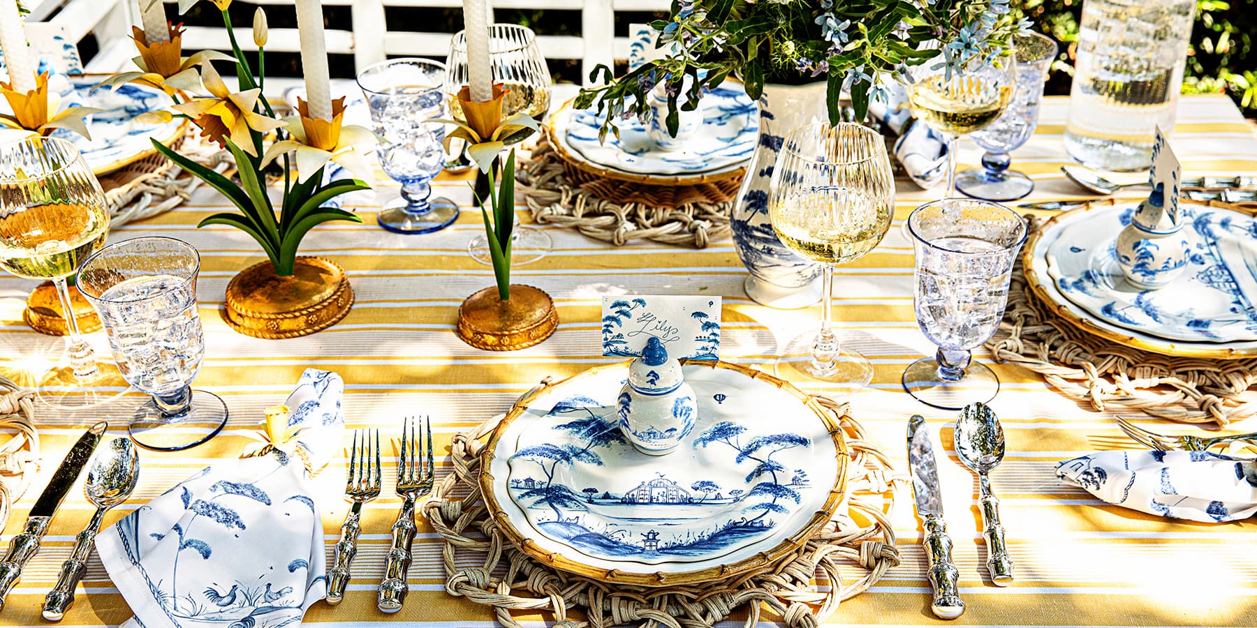 A tablescape of saturated yellows, golden bamboo dinnerware and delightful daffodil candelabras.