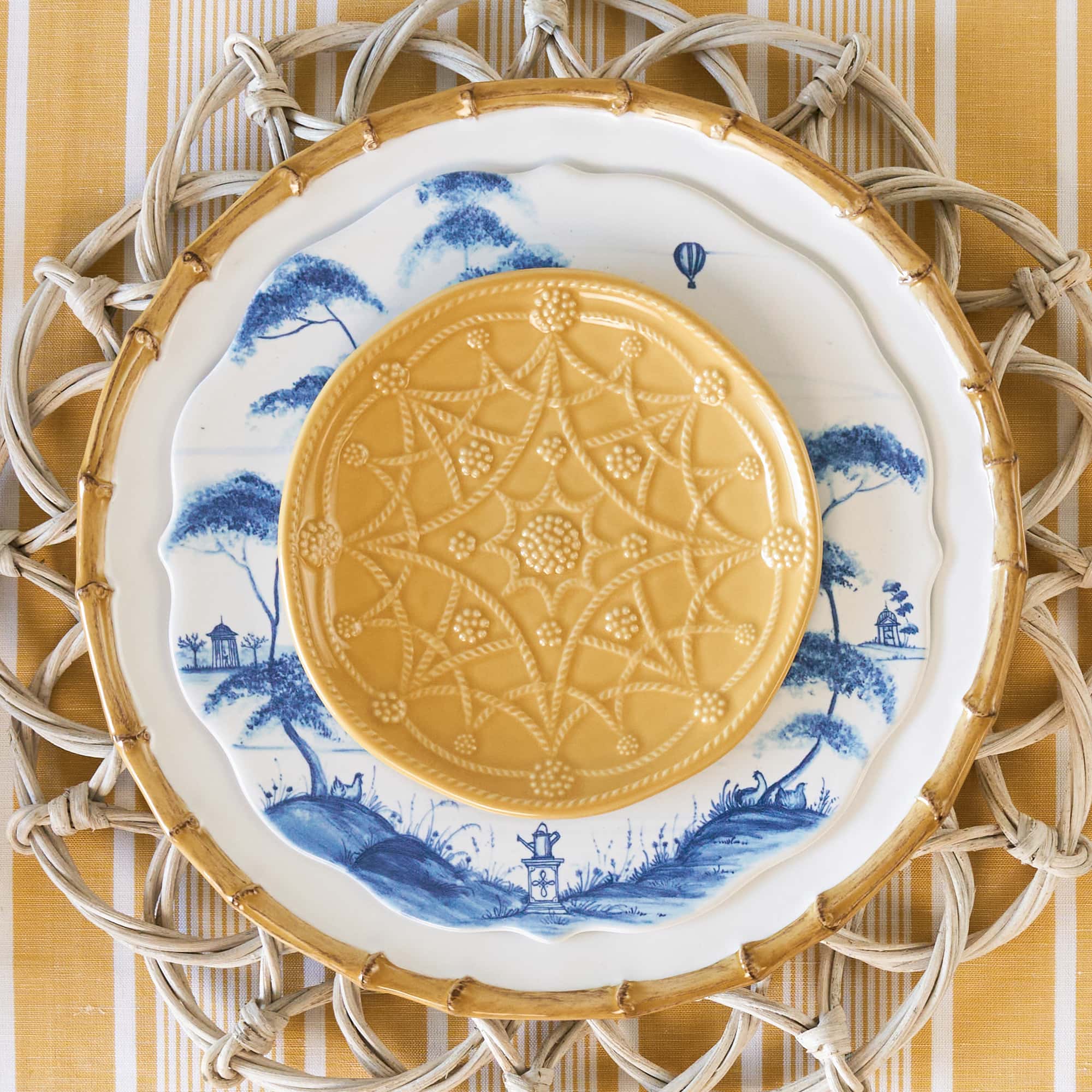 Image of 3 plates stacked: one bamboo dinner plate, one country estate dessert plate and jardin du monde cocktail plate.