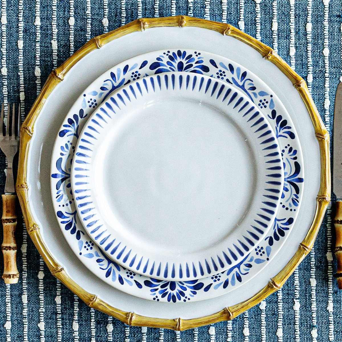 Sitio Stripe Delft Blue cocktail plate on a Iberian Blue plate.