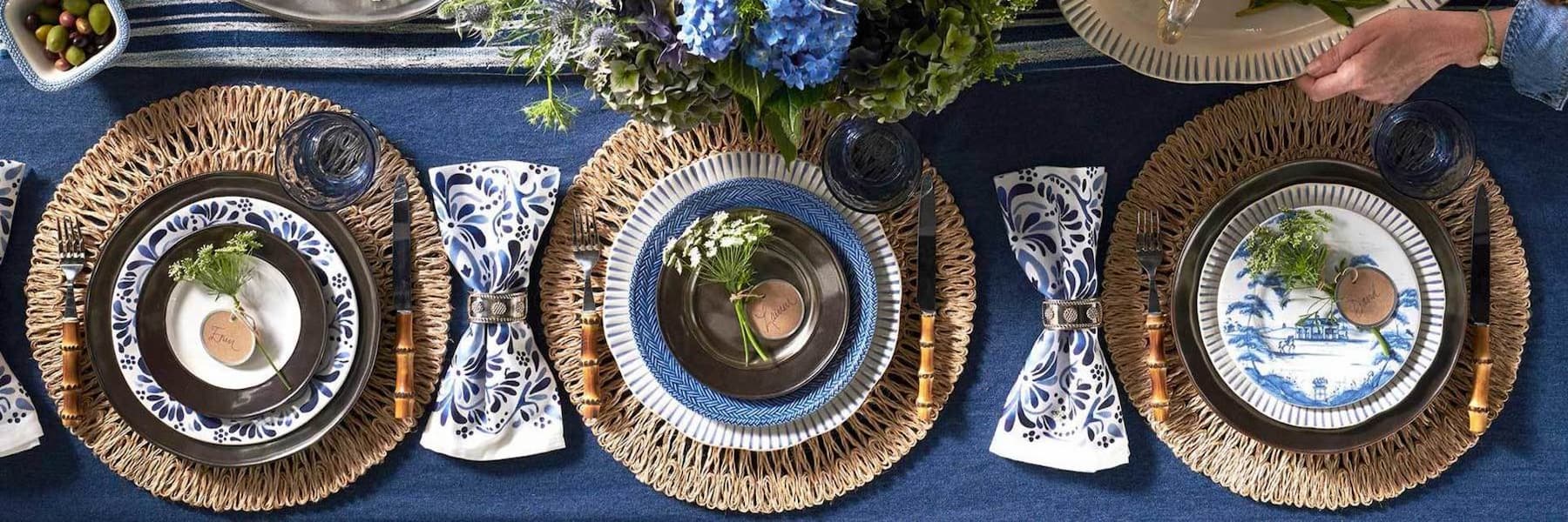Overhead image of blue, white and tan table settings.