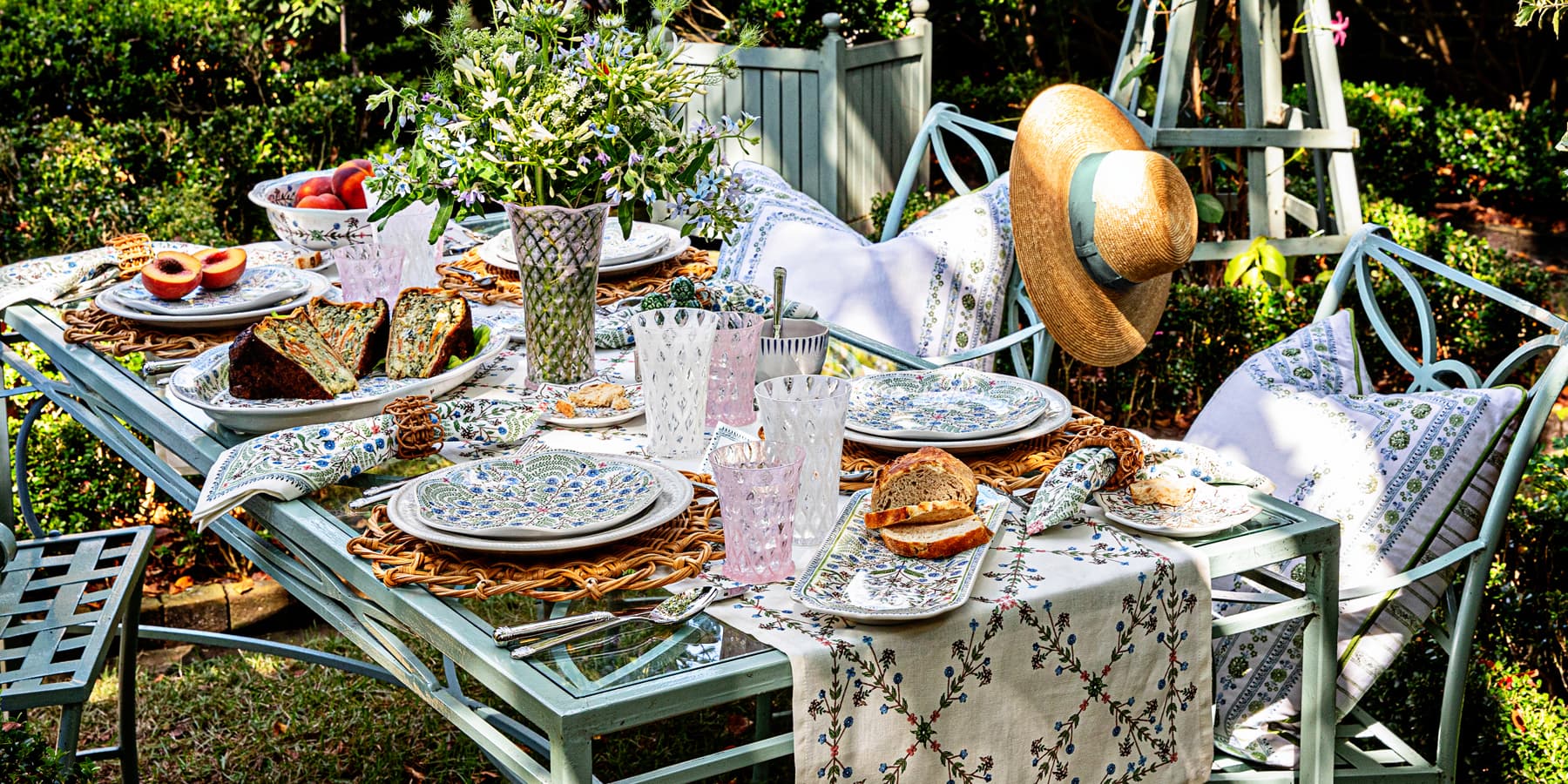 Al fresco tablescape featuring villa seville ceramics and linens