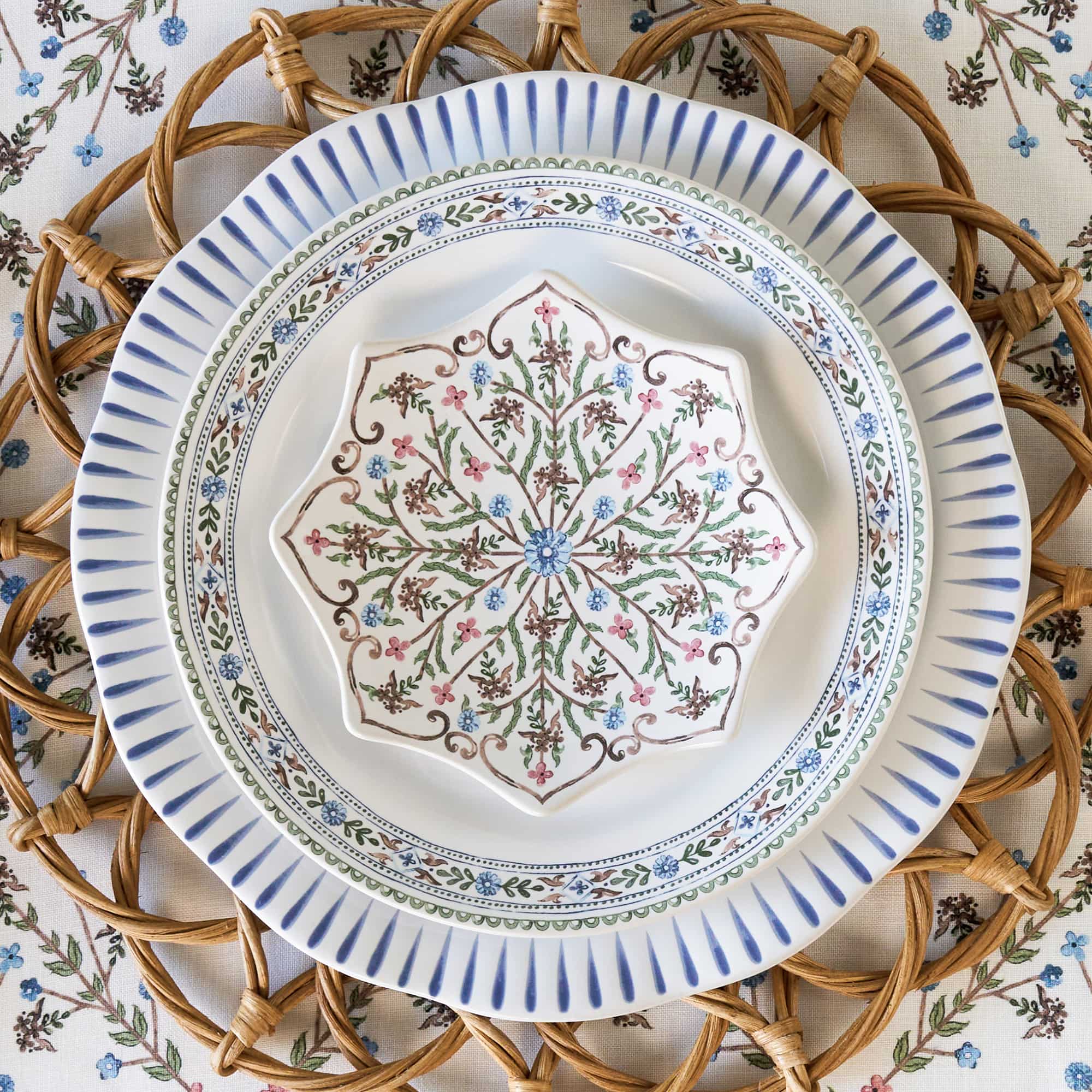 Mix and match of Villa Seville ceramic and linens with Sitio Stripe Delft blue plates