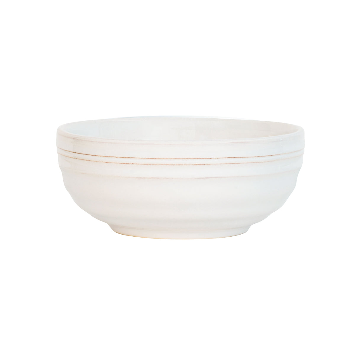 From our Bilbao Collection - The hand-hewn texture and warm whitewash glaze of this classic bowl pairs perfectly with everything from decadent mint chip ice cream at midnight to soul-warming slow-cooked oats at sunrise.Â
