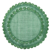 Natural fibers are woven in a rich green hue and embellished by a ruffled trim to create a frame for table settings that is both relaxed and elegant.