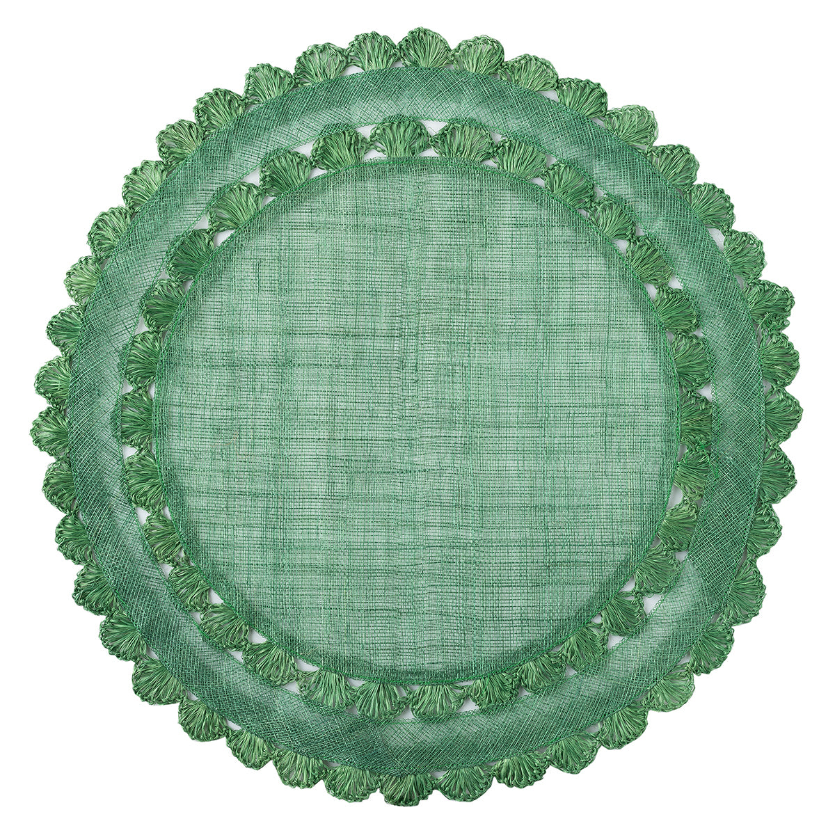 Natural fibers are woven in a rich green hue and embellished by a ruffled trim to create a frame for table settings that is both relaxed and elegant.