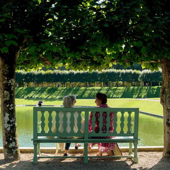 Capucine De Wulf Gooding & her mother sit at a bench reflecting on her mother's garden and the best metaphor for mothering is gardening.