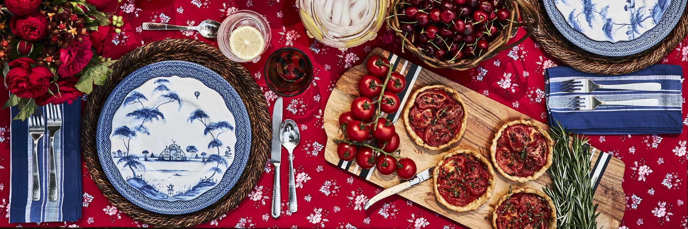 Pink, white and red florals in delicate white and blue vases.
