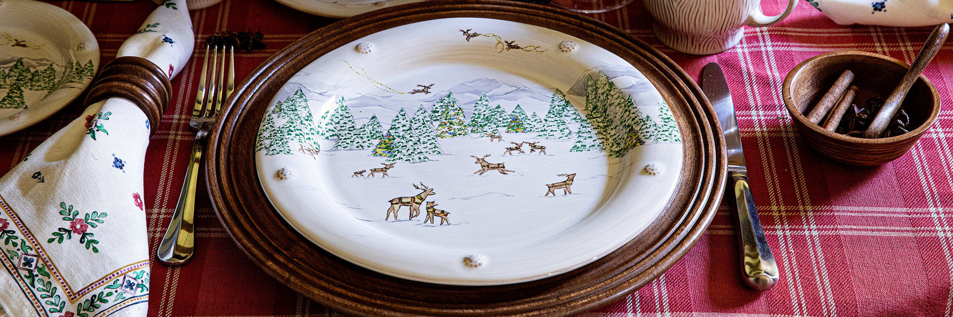 Berry and Thread North Pole dinner plate on a Bilbao charger makes the perfect holiday place setting.