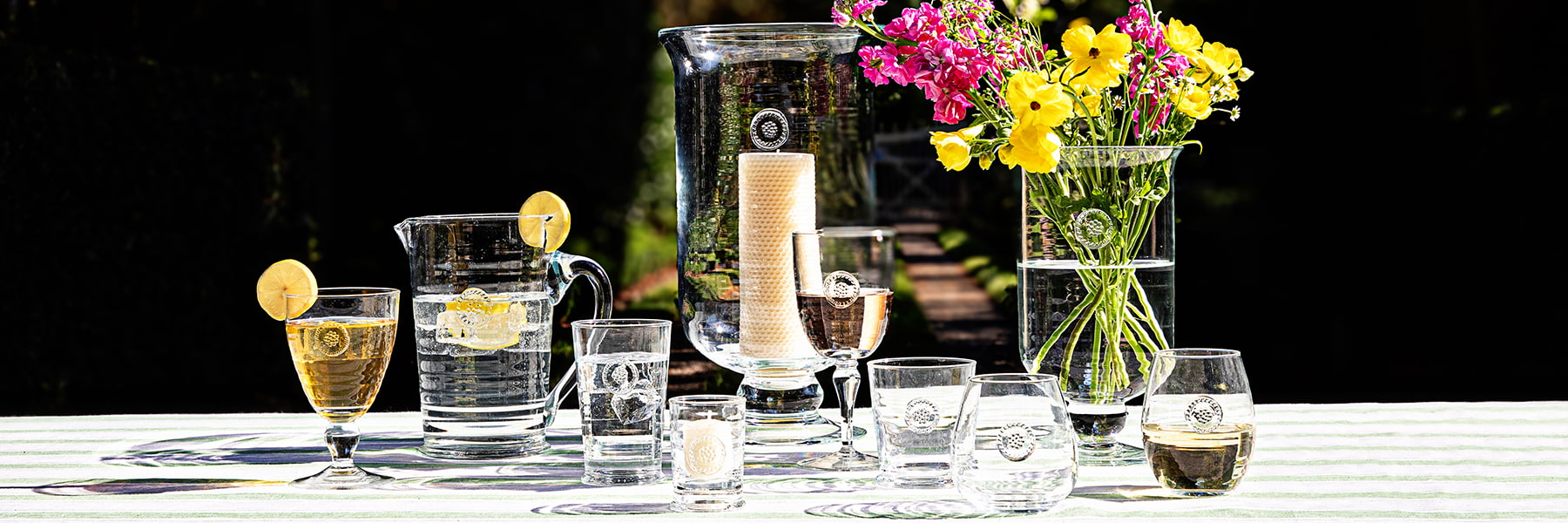 Berry and Thread glassware displayed on a table with florals