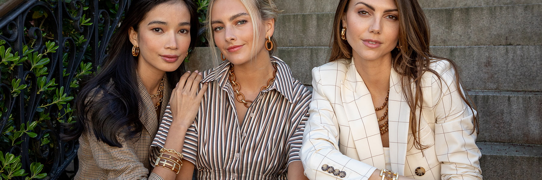 Woman wearing villandry jewelry in an outdoor garden setting