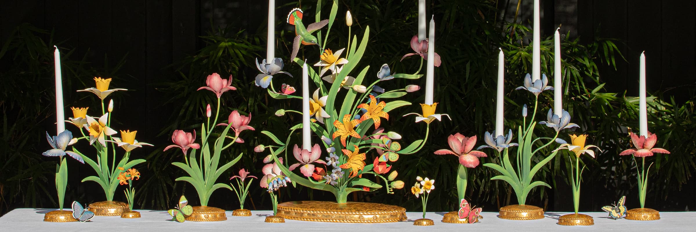 Image depicting pink and yellow Meadow Walk candelabras amongst an outdoor tablescape