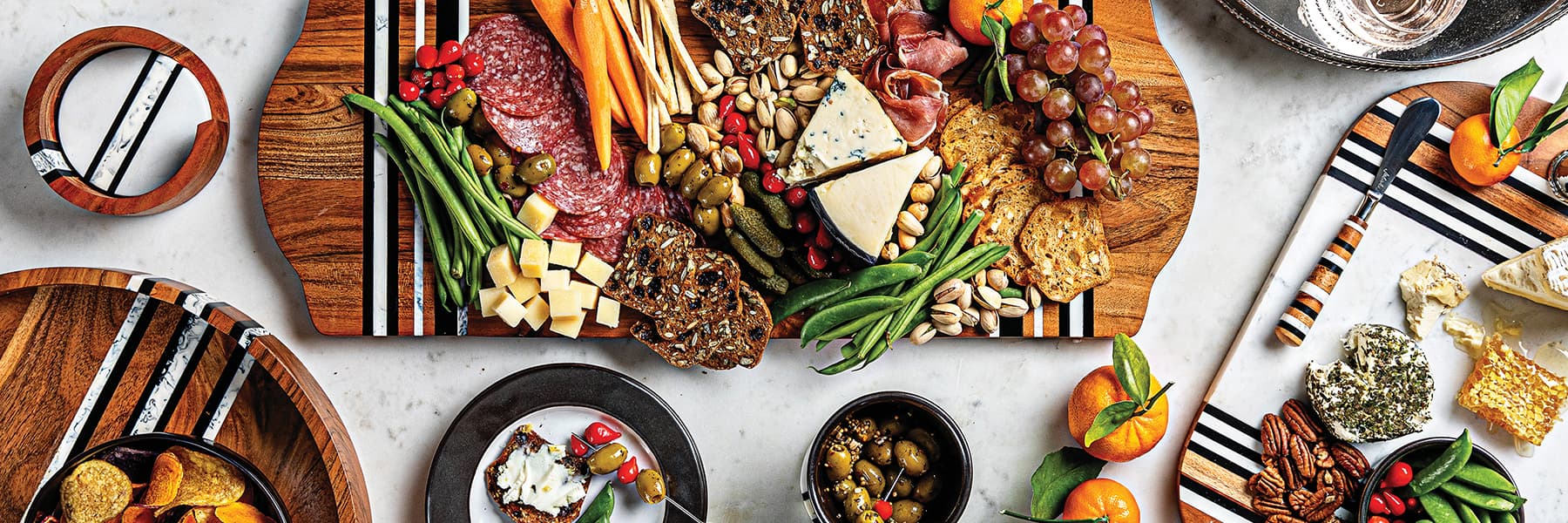 Stonewood stripe serving trays being used to display charcuterie boards