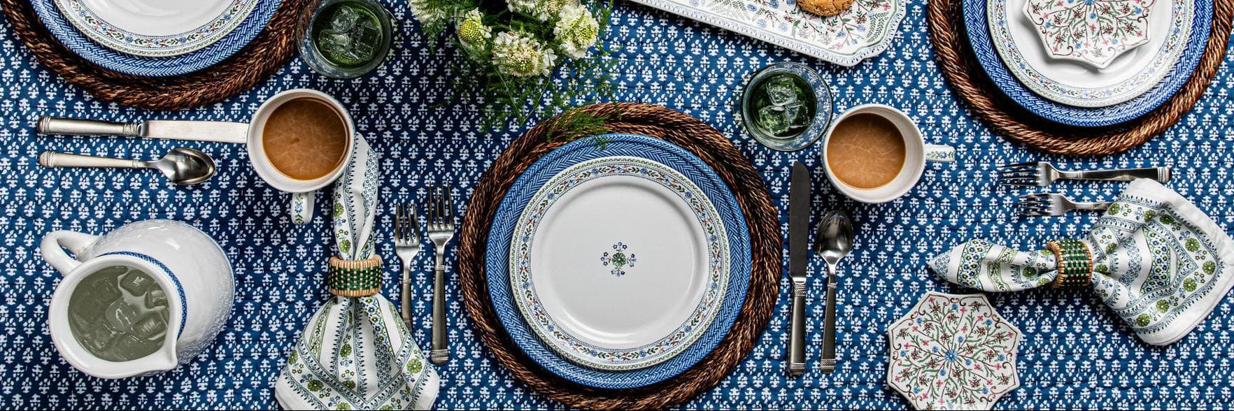 Villa Seville Salad Plate pops against a rustic charger on a blue tablecloth