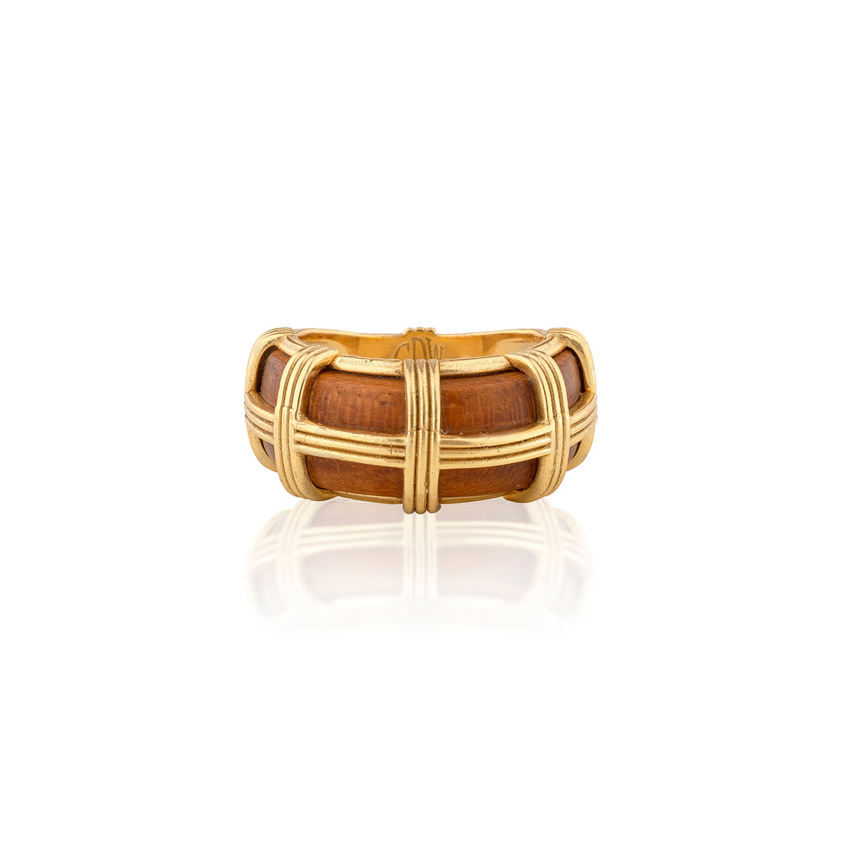 Gold and wooden ring on a white background