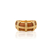 Gold and wooden ring on a white background
