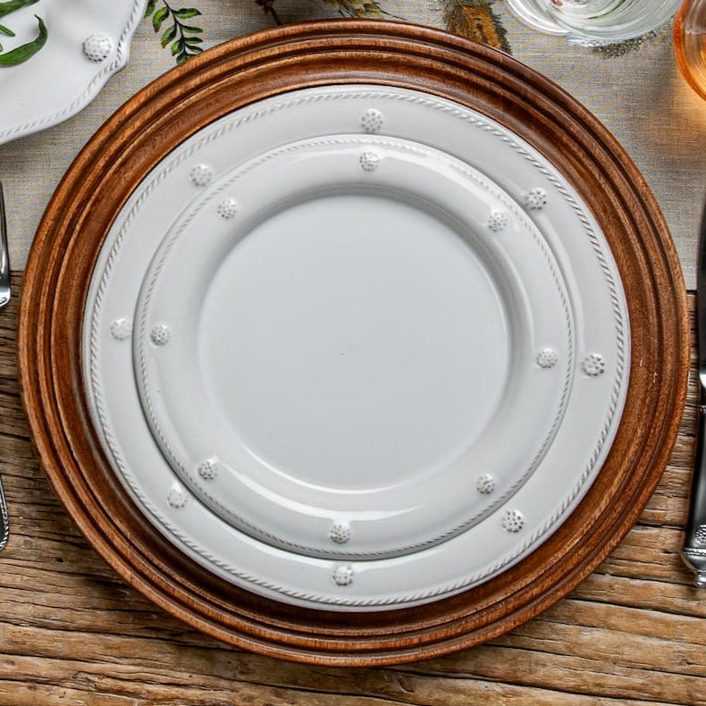 Classic Berry & Thread Whitewash dinner and salad plate pop against the natural wood grain of the Bilboa Charger.