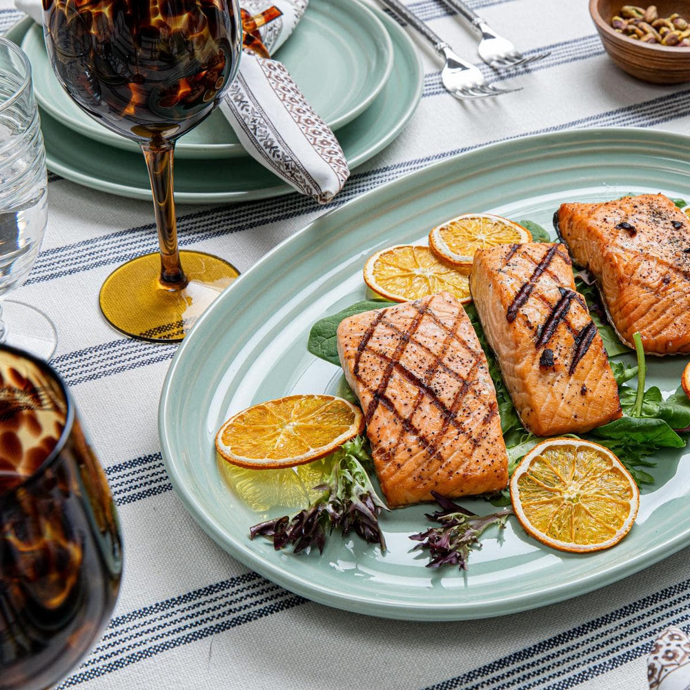 The Bilbao Sage collection with pops of Saffron colored napkins create the perfect transition look.