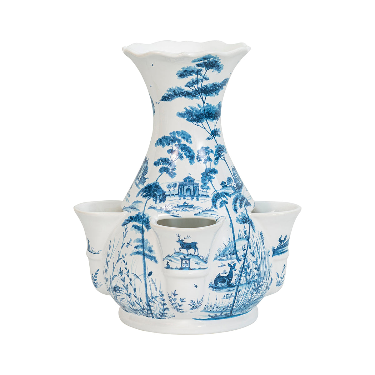 A white vase with four receptacles at the base for singular stems. It is decorated in blue with scenes of nature.