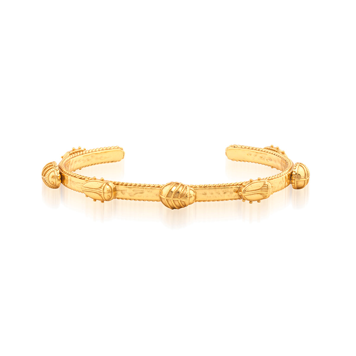 This dainty bangle in bright and shimmering hammered gold is sprinkled with tiny scarabs marching in a tidy line and rendered in exquisitely intricate detail, from their tiny feet to minuscule wings. We like to imagine they’re off to cocktail hour on the Nile at sunset. Perfectly lovely on its own, or to enliven any bracelet stack.