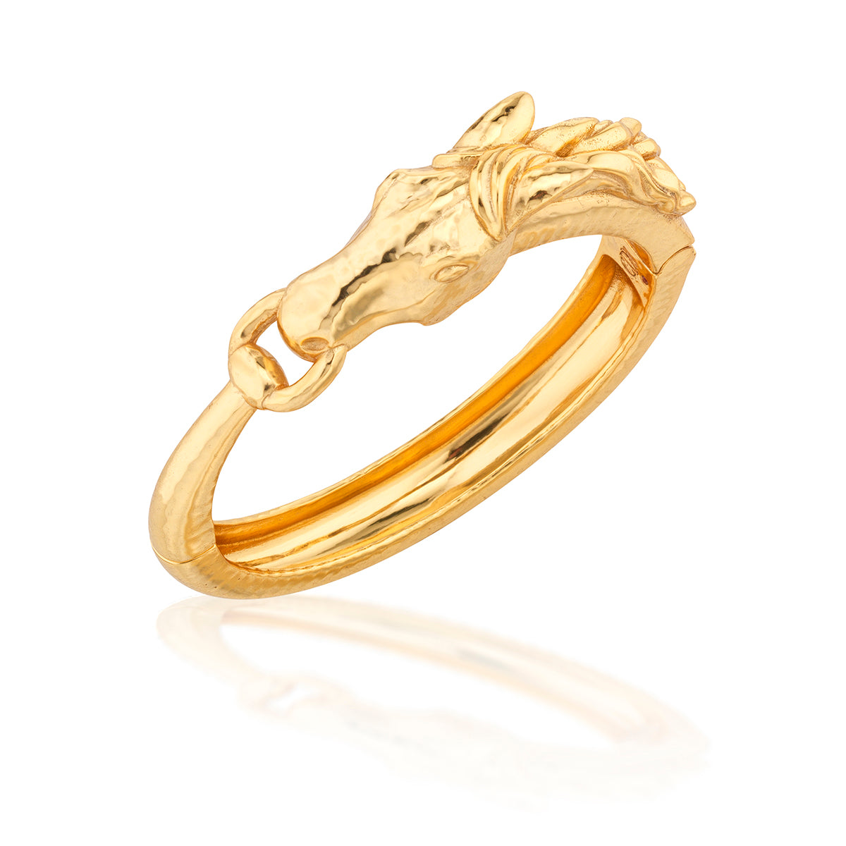Gold bangle with horse head design on a white background