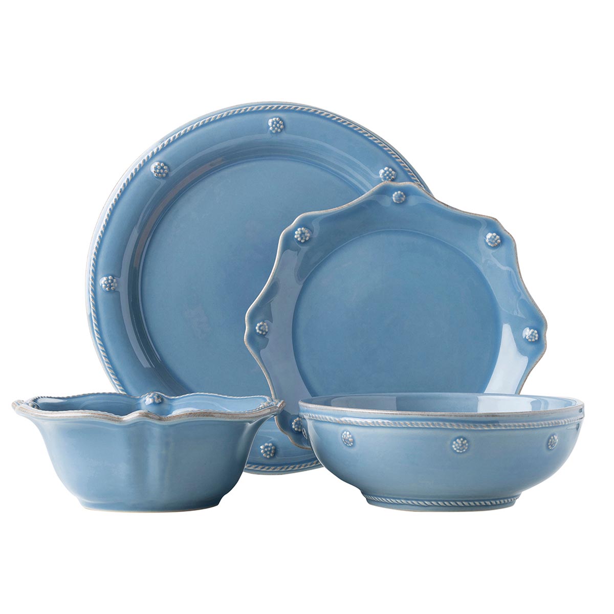 Four-piece place setting in blue, with either scalloped or threaded rims.