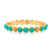 Trios of delectable, polished turquoise gem-drops are united by a sprinkling of golden berries to create this regal bangle that can elevate a pair of jeans or bring the perfect splash of glamour to your lucky business suit. Either way, it’s perfect for queening over your to-do list with exquisite style and grace. Stunning on its own, even better in a stack!