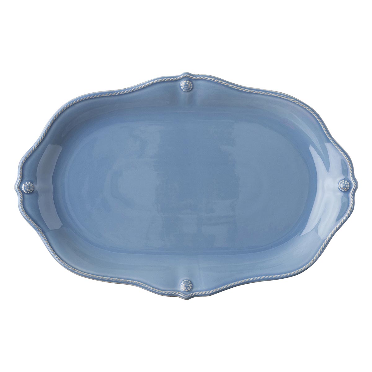 A blue platter with a scalloped edge.