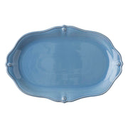 A blue platter with a scalloped edge.