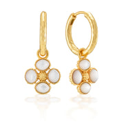 Classic hoops in hammered gold dangle our exquisitely detailed clover charms that are cleverly double-sided so you can choose how you wear them—gilded berry exterior with mother of pearl center or mother of pearl exterior with gilded berry center (or a combination)! Whichever clover you pick, the result is subtly stunning, romantic and unique. Lucky you!