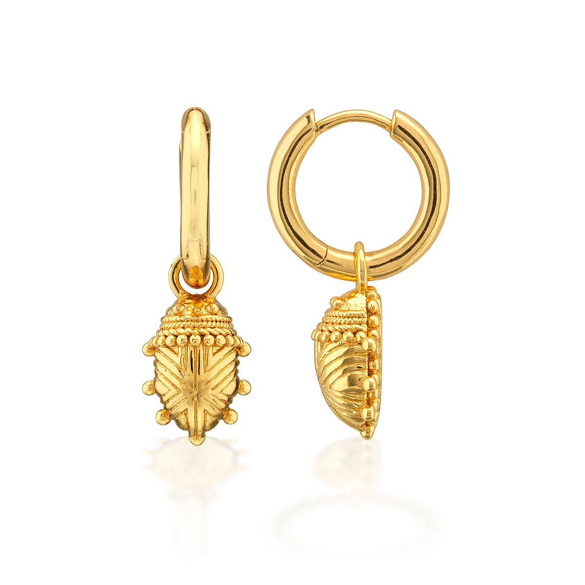 A pair of gold hoop earrings with dangling textured beetle charms, shown on a clean white background with a soft reflection.