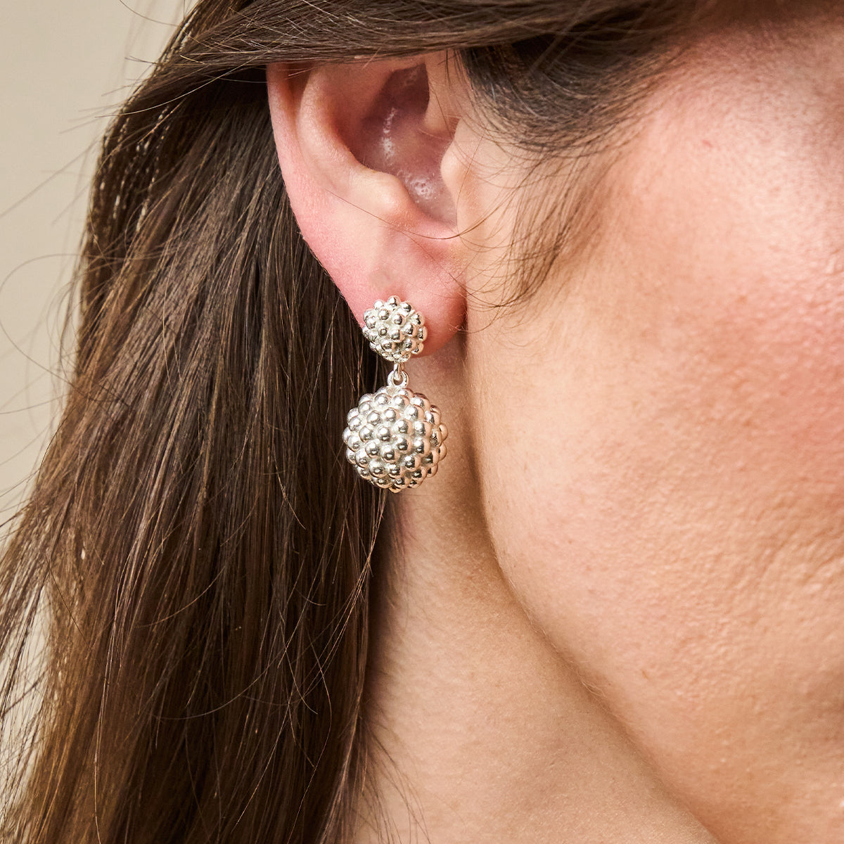 Berry Double Drop Earrings - Silver close up of earring on ear