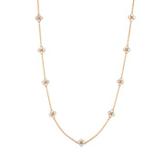 This dainty, double-sided station chain necklace is a vision in bright, gleaming gold and iridescent mother of pearl, interspersed with our clever double-sided clovers that playfully flip throughout the day—from mother of pearl clovers with golden berry centers to golden clovers with mother of pearl centers.